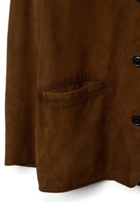 Brown suede jacket featuring a smooth texture, button closures, and a side pocket, with a subtle sheen and clean lines.