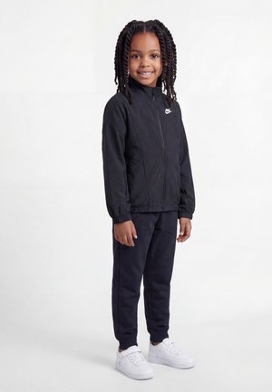 Nike Sportswear TRACKSUIT UNISEX SET - Dresside alumine osa - black/white