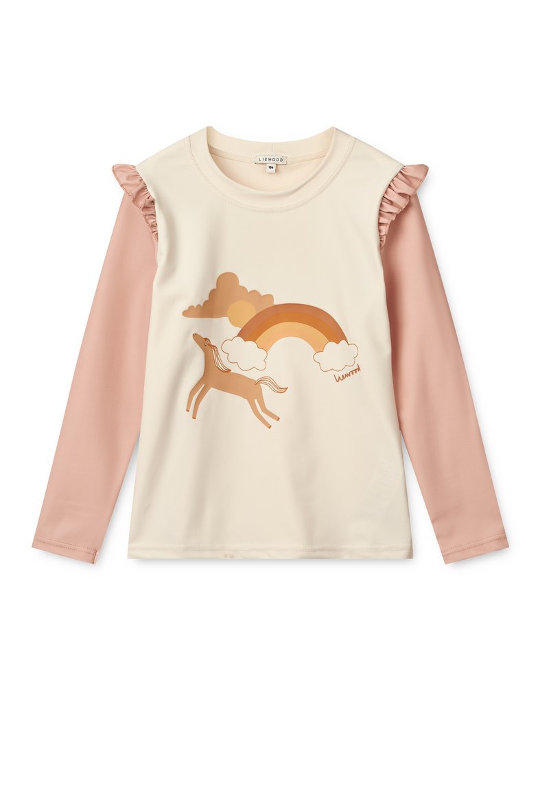 Langermet topp med kremfarget kropp, blush rosa ermer, volanger, og et motiv av en hest, regnbue og skyer i varme toner.