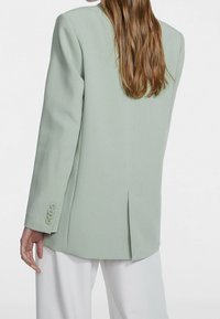 Stradivarius Halflange jas - khaki