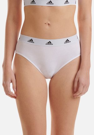 White cotton brief with a high waist and a wide elastic band featuring black Adidas branding. Smooth texture and fitted design.