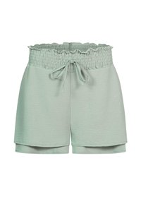 Lysegrønne shorts laget av mykt stoff, med en smocket midje med bølget kant og snøring. Sømmen har sidesplitter.