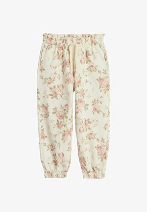 Kwiatowe dresy w kolorze kremowym z różowymi różami i zielonymi liśćmi. Posiadają elastyczny pas i ściągacze przy kostkach.