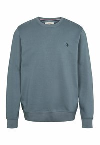 Mikina s okrúhlym výstrihom v tlmenej modrej farbe, vyrobená z jemnej bavlnenej zmesi. Má ribbované manžety a lem, s malým čiernym logom na hrudi.