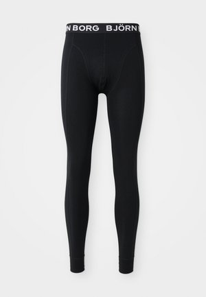 Schwarze Leggings aus elastischem Material. Mit einem weißen elastischen Bund mit dem "BJÖRN BORG" Logo. Glatte Textur, figurbetonte Passform.