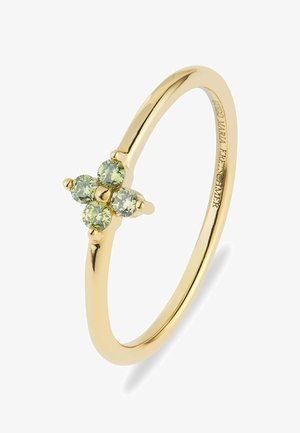 Anello d'oro con quattro piccoli pietre preziose rotonde verde chiaro disposte a forma di croce su una fascia sottile.