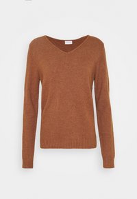 Brun v-ringad tröja i mjukt stickat material, med långa ärmar samt ribbade avslut vid nederkant och ärmslut. Enkel och klassisk design.