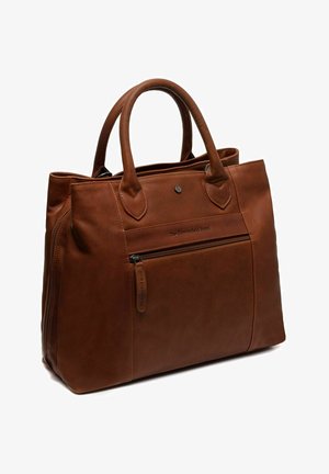 Brown leather tote bag with dual handles, a zippered front pocket, and subtle branding on the front. Smooth texture and structured design.