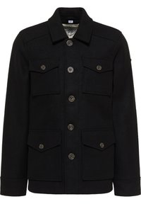 Zwarte wollen jas met een knoopsluiting aan de voorkant, twee borstzakken en twee onderzakken. Heeft een puntige kraag en een rechte pasvorm.