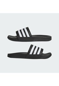 Black slide sandals with a textured black strap featuring three white stripes, flat sole, and smooth finish, suitable for casual wear.