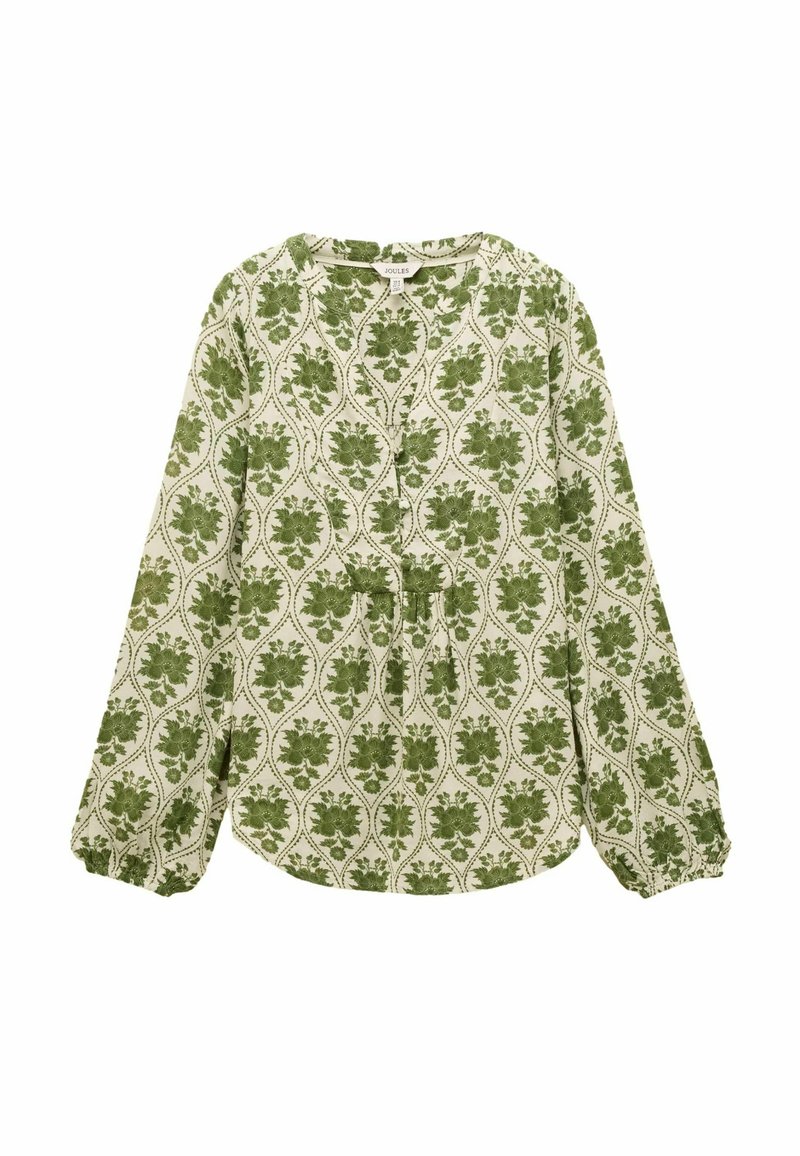 Gaiškrēmīga garrokas blūze ar zaļu ziedu rakstu. Aprīkota ar apaļu kakla izgriezumu un savilktām piedurknēm, kas piešķir papildu tekstūru un dizaina detaļas.