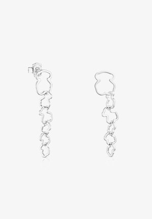Srebrne kolczyki z designem łańcuszka, z abstrakcyjnymi kształtami przypominającymi niedźwiedzie. Kolczyki mają polerowane wykończenie i lekką formę.
