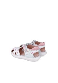 Sandalias blancas con acentos rosas, diseño recortado y patrón floral. Cuentan con correa ajustable y plantilla acolchada para mayor comodidad.