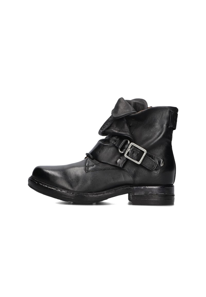 Black leather ankle boot with folded top and adjustable buckle strap on the side, featuring a low stacked heel and rounded toe.