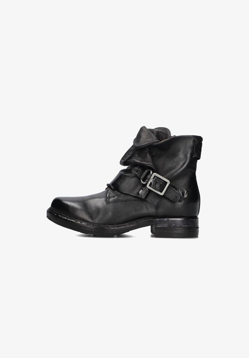 Black leather ankle boot with folded top and adjustable buckle strap on the side, featuring a low stacked heel and rounded toe.