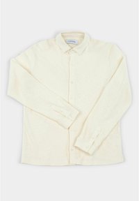 Crème, lange mouwen knopshirt met een kraag. Bevat een textuurstof, zeven knopen en manchetten met verstelbare knoopsluitingen.
