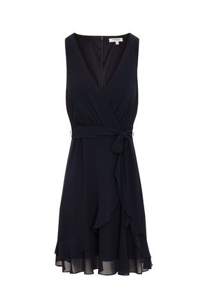 Robe sans manches navy avec un décolleté en V profond, design drapé et ourlet froncé. Fabriquée en tissu doux avec une taille à nouer et une fermeture éclair dans le dos.