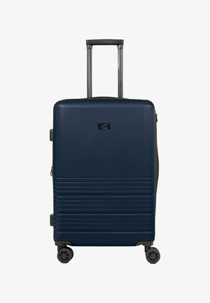 Hartschalentrolley in Marineblau mit strukturierter Oberfläche, vertikalen Rillen, zwei multidirektionalen Rädern und einem ausziehbaren Griff.