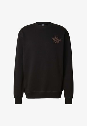 Černá mikina s kulatým výstřihem, dlouhými rukávy, žebrovanými manžetami a lemem. Na hrudi je hnědé logo "Do Nothing Club".