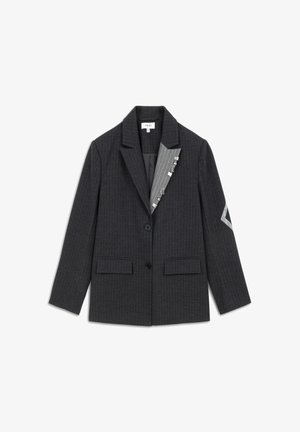 Dark gray pinstriped blazer with two buttons, flap pockets, and a contrasting gray pinstriped inner lapel detail pinned with metal clips.