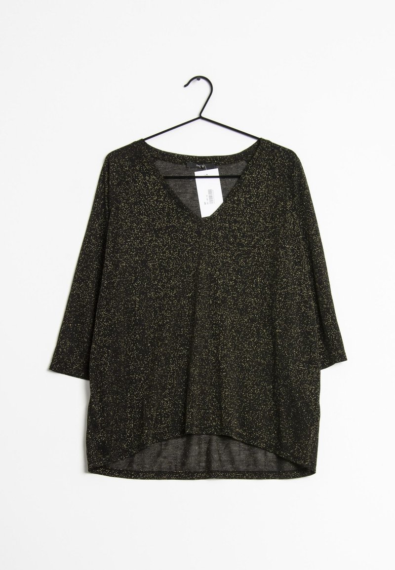 Top nero con speck dorati, design a V, maniche a tre quarti, vestibilità ampia e orlo curvo. Il materiale sembra leggero e dalla texture interessante.