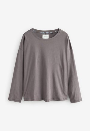Grijze longsleeve t-shirt van zachte katoen met een ronde halslijn en verlaagde schouders. Kenmerkt zich door een eenvoudig ontwerp zonder patronen of accenten.