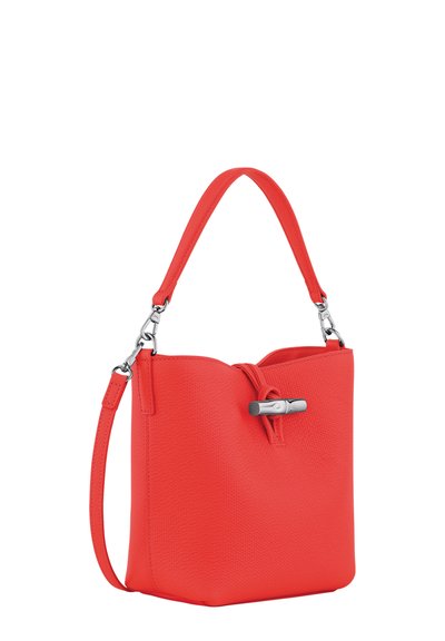 Red textured leather handbag with a structured shape, featuring a top handle and detachable shoulder strap, secured with a silver-tone hardware clasp.