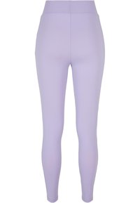 Pastell lilla leggings med et glatt, stretchy stoff, høy midje og en smal passform, designet for komfort og fleksibilitet.