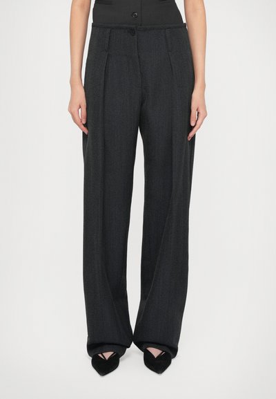 Dark gray, wide-leg trousers with front pleats. Made of textured fabric, featuring a button closure and a tailored design.