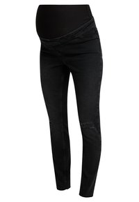 Jeans de maternidad negros ajustados con una suave banda sobre el abdomen, detalles desgastados en las rodillas y una textura clásica de denim. Ajuste diseñado para la comodidad.