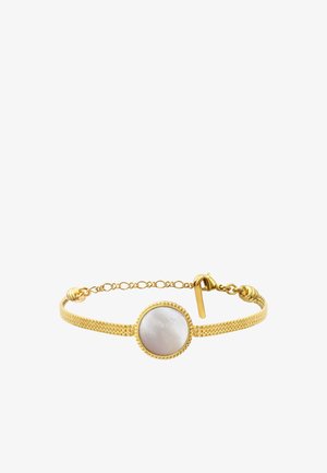 Bracelet en or avec un bandeau en maille fine et un centre rond en nacre blanche, fermé par une petite chaîne à bascule en or.