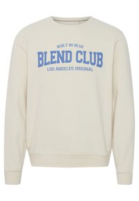 Kremfarget hettegenser med blå trykt grafisk tekst som leser "BLEND CLUB," med ribbestrikkede ermer og nederkant.