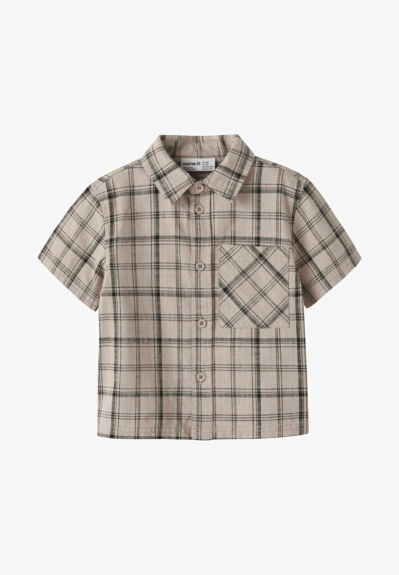 Chemise beige à manches courtes avec boutons, motif à carreaux noir et blanc et poche poitrine avant.