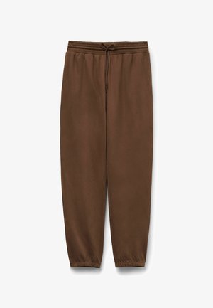 Brown sweatpants with an elastic waistband and adjustable drawstring. Tapered legs with elastic cuffs at the ankles. Soft texture.