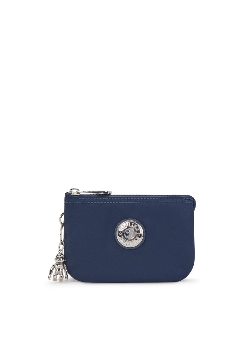 Navy nylon wallet with silver zipper and coin charm. Features a round silver logo accent on the front. Smooth texture, rectangular shape.