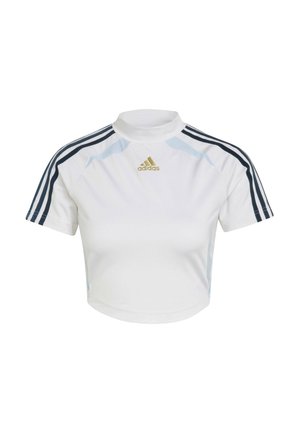 Valkoinen lyhyt urheilupaita, jossa on lyhyet hihat, tummansiniset raidat ja korkea kaulus. Kultainen "Adidas"-logo edessä.