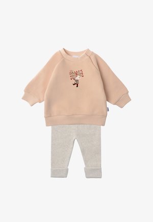 Light pink sweatshirt with ribbed cuffs featuring a cartoon character holding a gift, paired with light gray cuffed leggings in soft fabric.