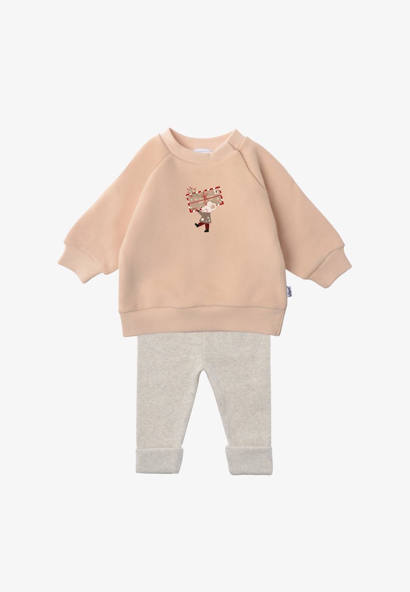 Light pink sweatshirt with ribbed cuffs featuring a cartoon character holding a gift, paired with light gray cuffed leggings in soft fabric.