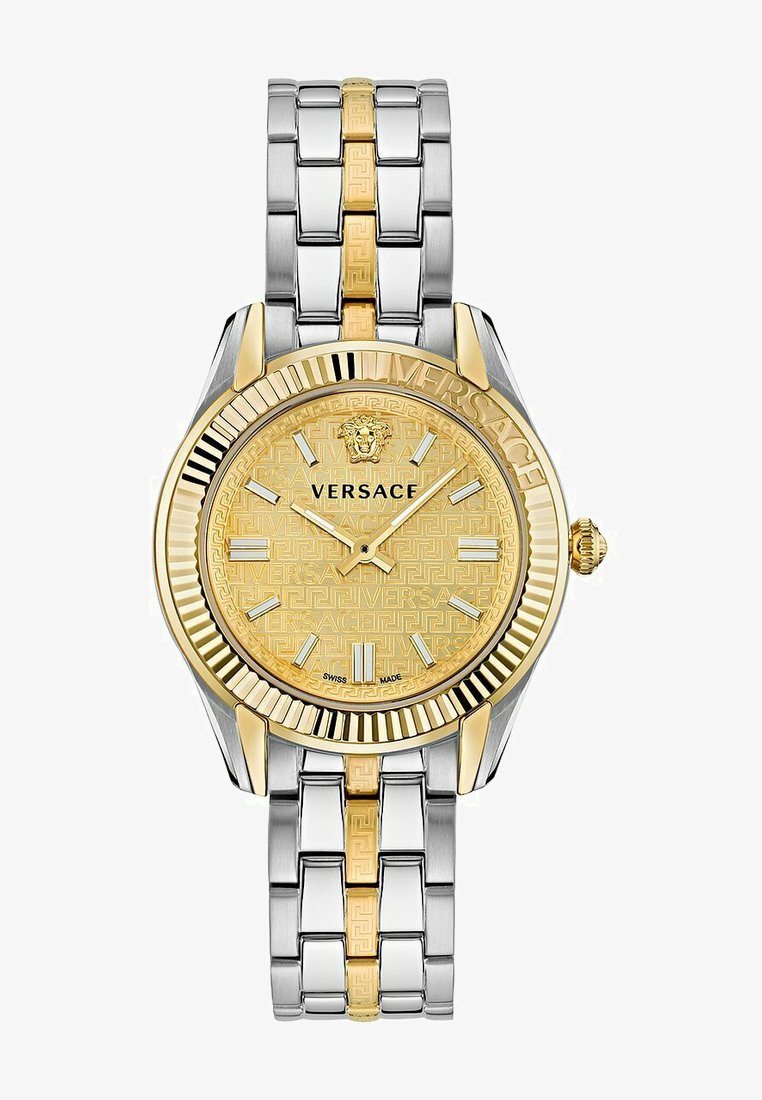 Gold and silver stainless steel watch with patterned dial featuring a lion emblem, hour markers, and a two-tone link bracelet.