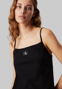 Calvin Klein Jeans MILANO A LINE STRAPPY DRESS - Džersio suknelė - black