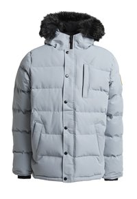 Veste matelassée gris clair avec une capuche en fausse fourrure, couture verticale, fermeture à boutons à l'avant, deux poches latérales et une petite poche poitrine zippée.
