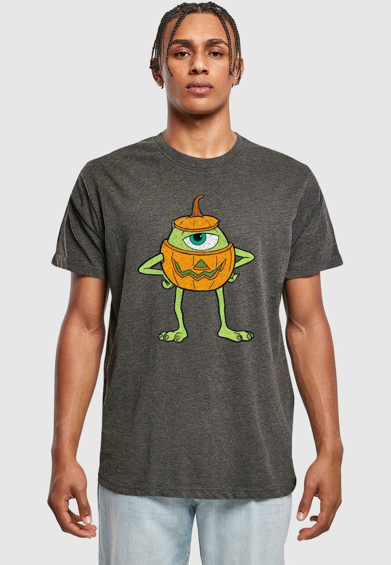 Grå bomulds t-shirt med et grafisk motiv af et grønt monster med et øje og et græskar-design, detaljeret med en orange top og et trekantet ansigt.