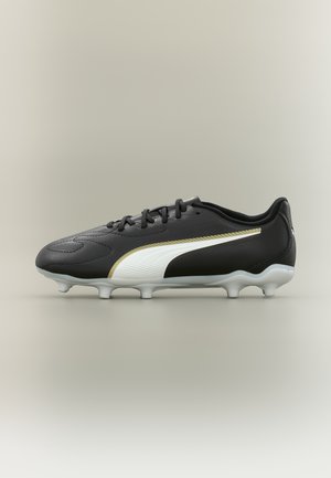 Black soccer cleat with white and gold Puma logo, white studs, and black laces on a neutral gray background.