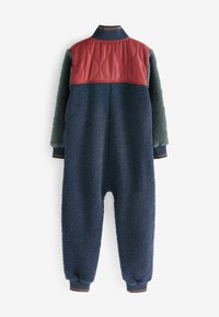 Bodycon di colore blu navy con texture soffice, pannello inclinato in velluto bordeaux, polsini a coste, colletto in contrasto e design dalla vestibilità rilassata.