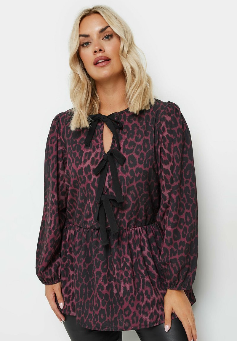 Musta ja purppura leopardi-kuosiset pusero, jossa on avainaukko kaula-aukko sidontakohdilla, pitkät puffihihat ja rento malli.