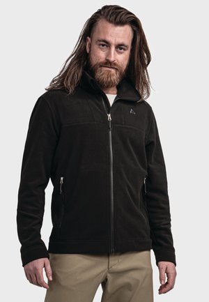 Dunkelgrüne Fleecejacke mit hohem Kragen, Frontreißverschluss und Seitentaschen. Mit einem markanten Logo auf der linken Brust. Weiche Textur.