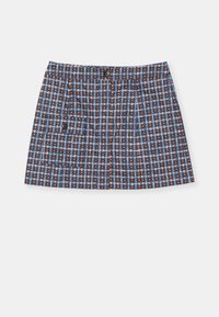 Jupe à motif bleu avec un design en grille, comprenant des points orange. Coupe droite, détail boutonné et poches sur les côtés.