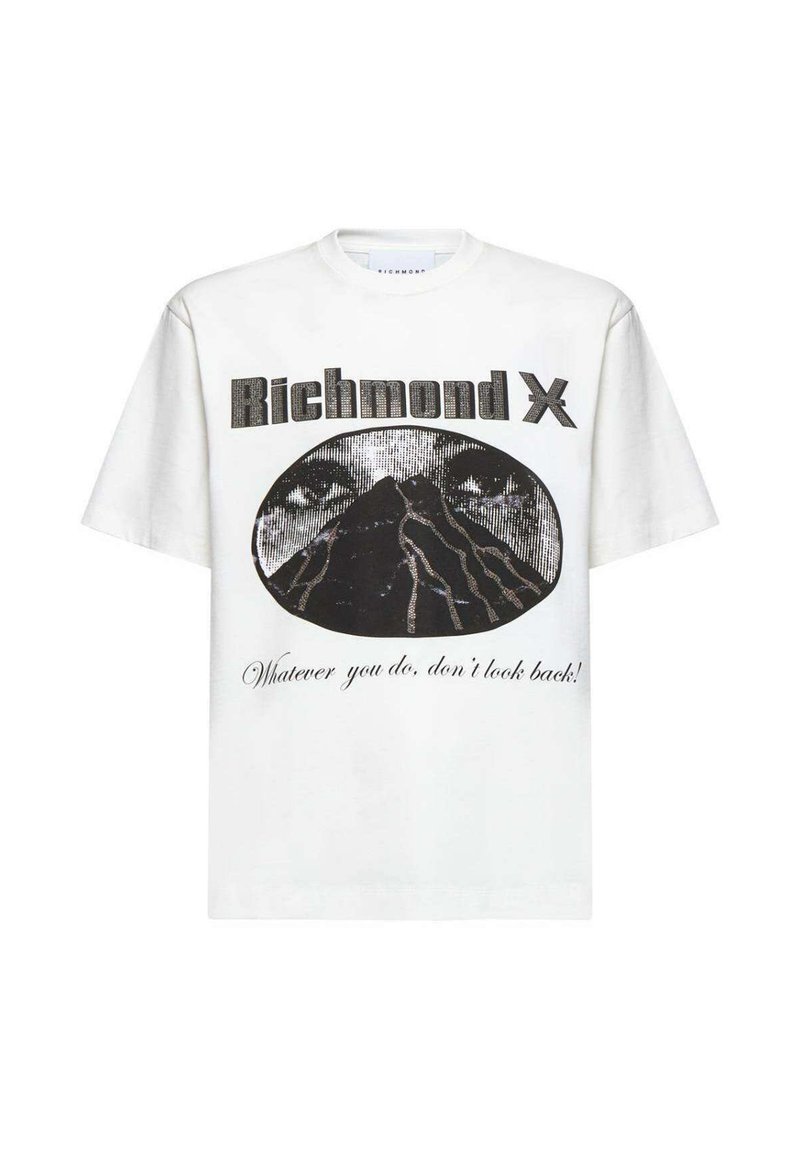T-shirt bianca in cotone con maniche corte, caratterizzata da una stampa grafica di un vulcano, occhi e testo in nero. Vestibilità rilassata, con scollo rotondo.