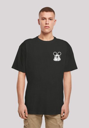 Sort bomulds t-shirt med et hvidt tegneserie-mus grafik på venstre brystområde. Korte ærmer og en afslappet pasform.