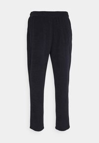 Svarta sweatpants gjorda av mjukt tyg, med elastisk midja, sidofickor och rak bendesign. Slät yta genom hela plagget.